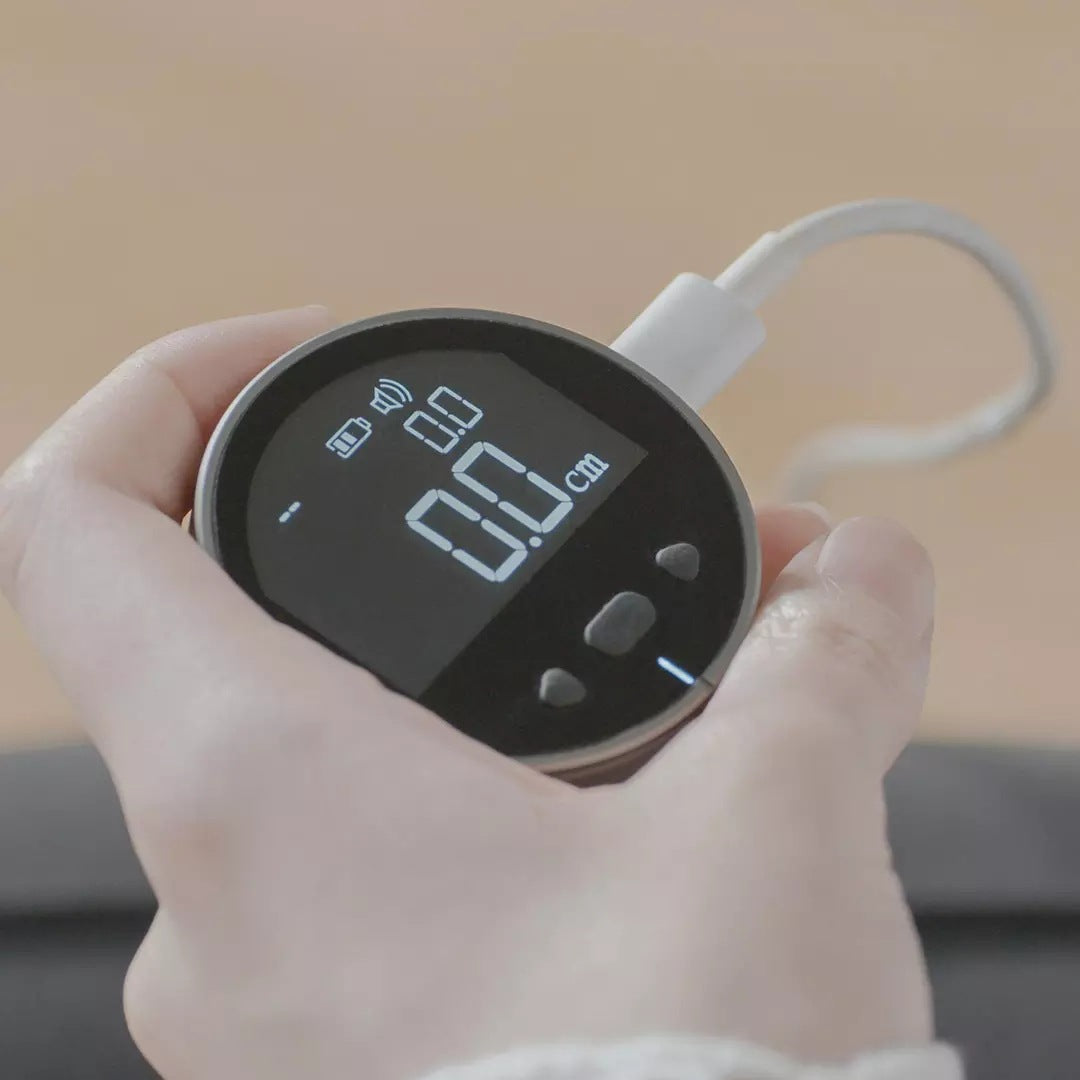 Compact Electronic Measuring Tape on table